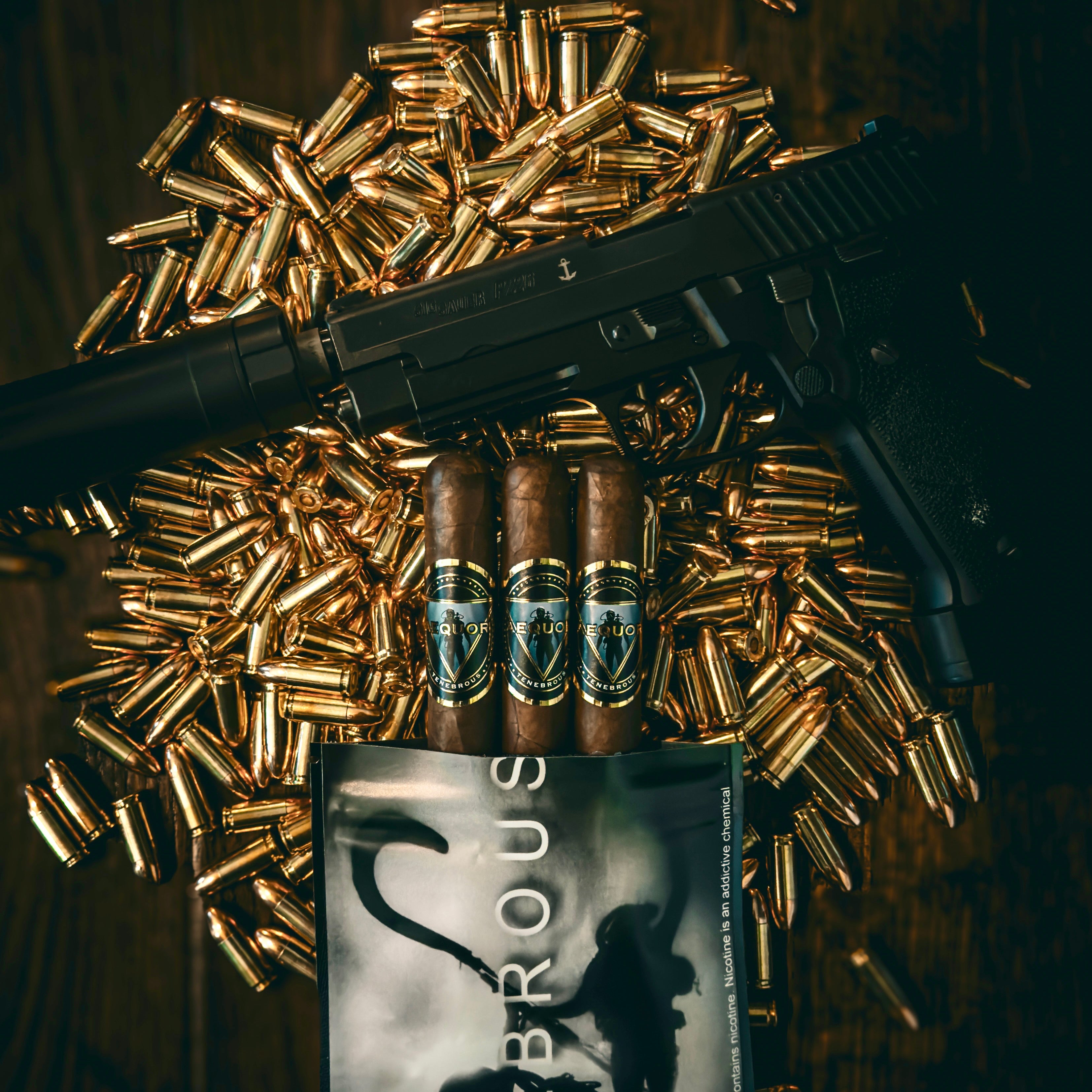 SIG P226, Supressor, 9mm bullets, and Tenebrous Aequor cigars on a reflective surface with a dark background