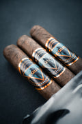Three Tenebrous Aequor cigars with 'premium' labels on a dark background